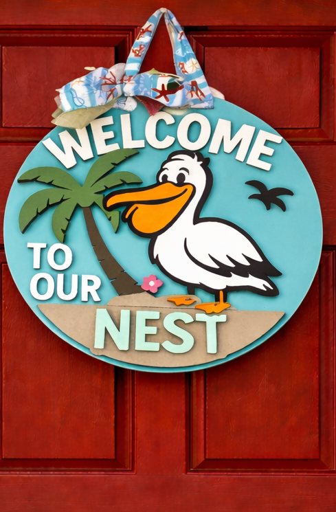 Welcome to Our Nest Pelican Door Hanger – 16” Layered Wood Sign | Coastal Front Door Decor | Beach House Welcome Sign
