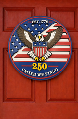 Decorative door sign with eagle and American flag design on a red door.
